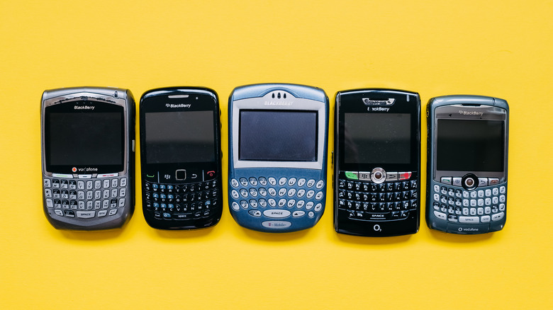 BlackBerry phones on a yellow backdrop