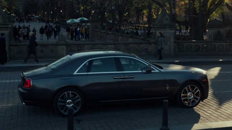 a Rolls-Royce Ghost Series II driving on a brick road in "John Wick: Chapter 2"