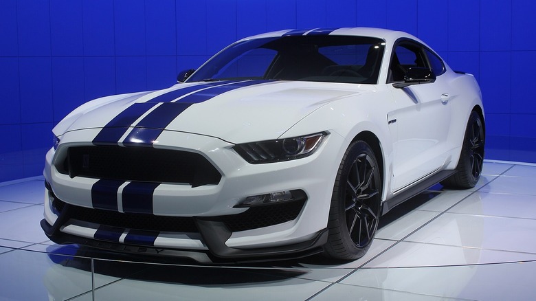 White and blue Ford Mustang Shelby GT350 on white tiles