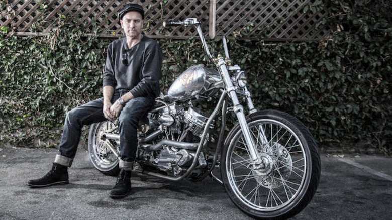 Ewan McGregor sitting on his customized Indian Larry chopper