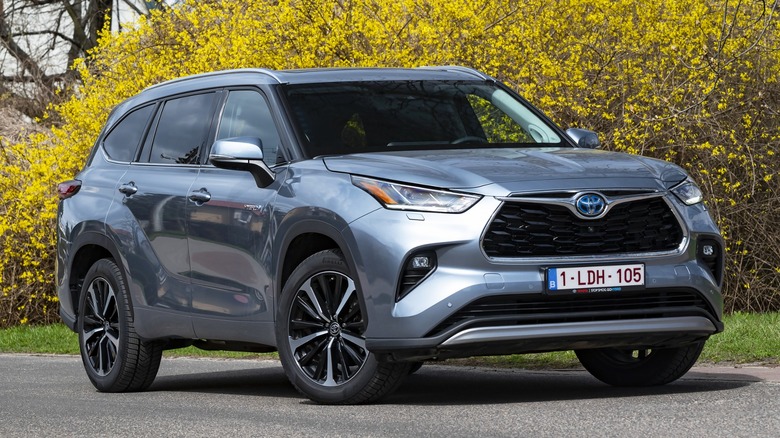 Blue Toyota Highlander parked street