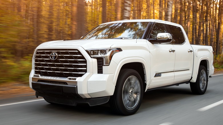 White Toyota Tundra i-FORCE MAX driving road
