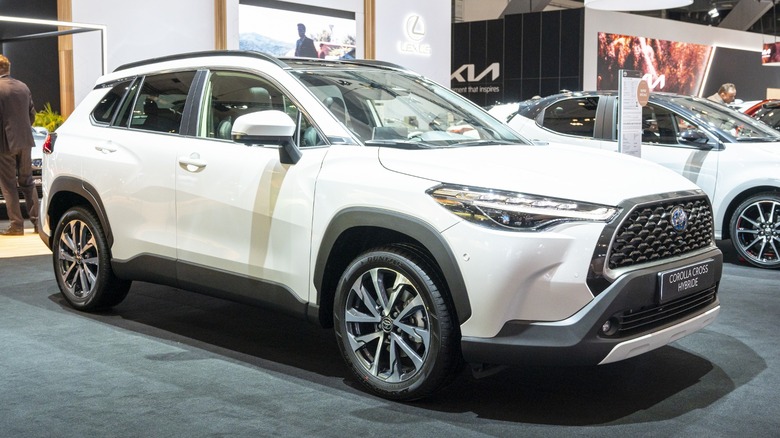 White Corolla Cross parked showroom