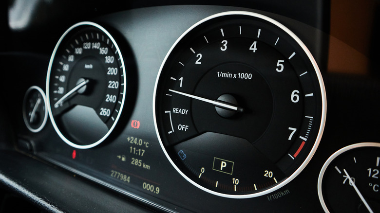 A speedometer on a car's dashboard.