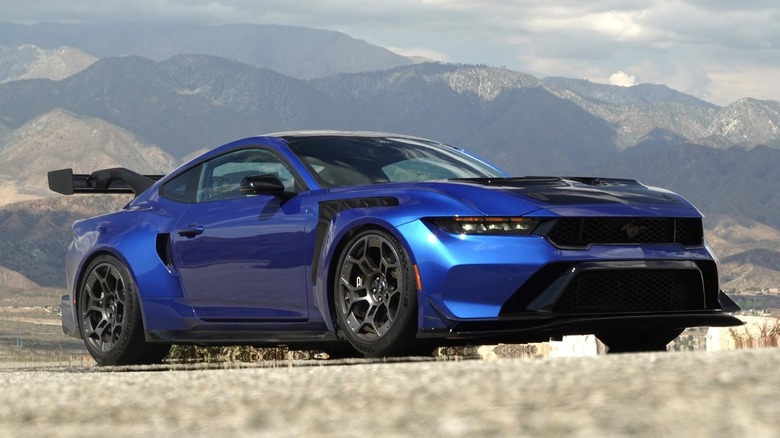 2025 Ford Mustang GTD parked in front of a mountain