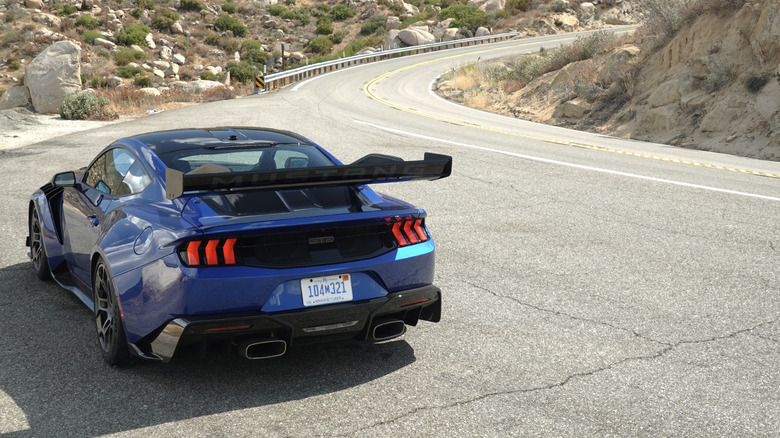 2025 Ford Mustang GTD rear three-quarters on a mountain road