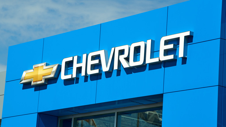 Chevrolet name and logo on blue dealership building