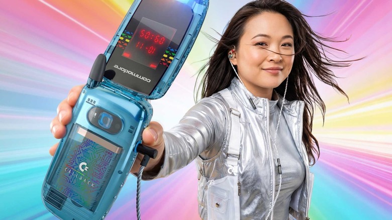 A young woman holding the Commodore Callback 8020 flip phone