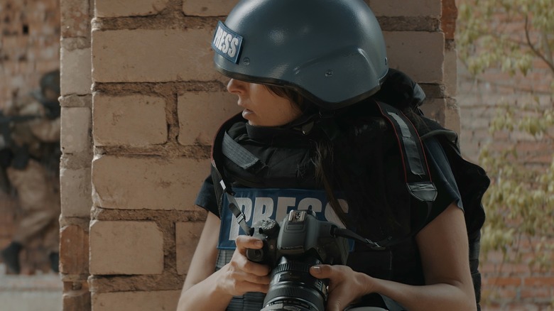 photographer in bulletproof vest
