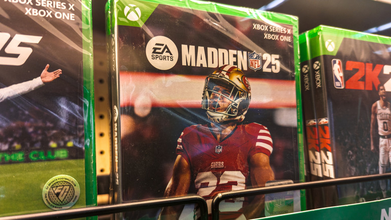 New copies of EA Sports Madden NFL 25 and other Xbox games on shelf