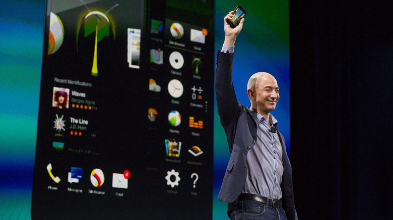 Jeff Bezos holding Amazon Fire Phone