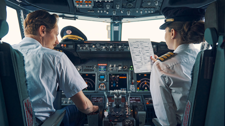 airplane pilots in cockpit