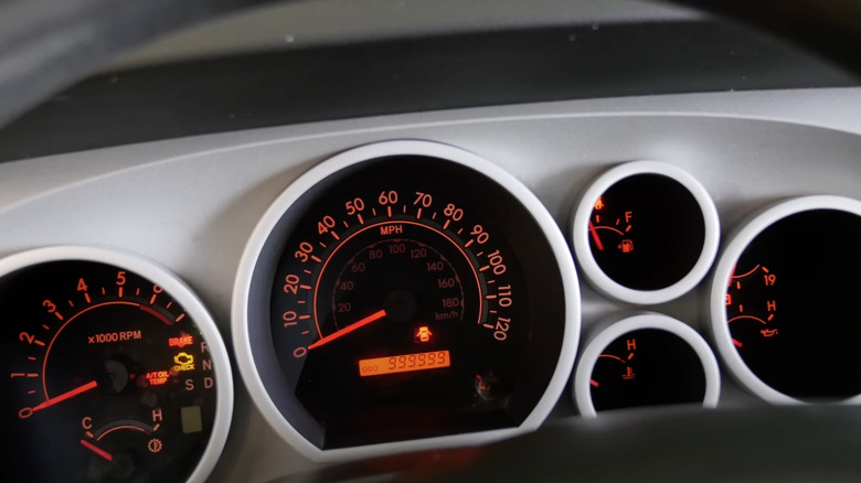 The gauge cluster in the million mile Toyota Tundra showing the maxed out odometer