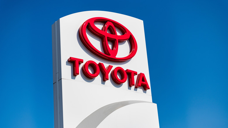 A Toyota dealership sign on a bright sunny day