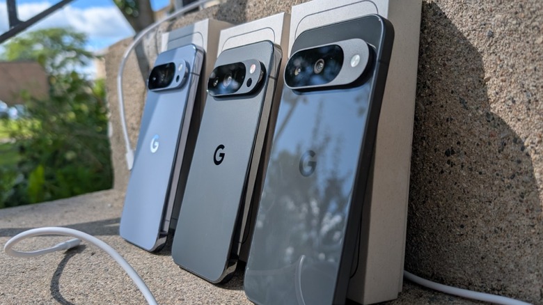 Google Pixel 10 Pro XL and 10 Pro and 10 lined up on cement.