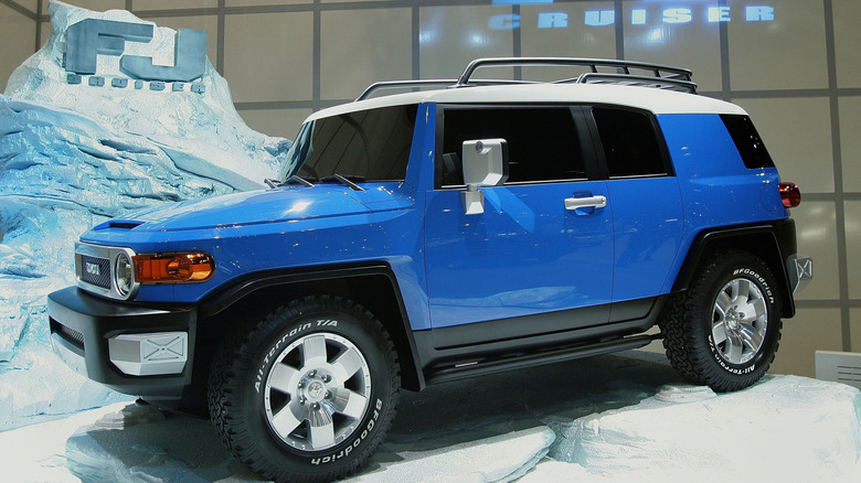 a blue FJ Cruiser displayed at an auto show