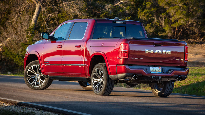 Red 2025 Ram 1500 Tungsten parked on a road