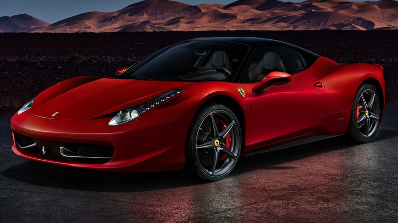 Red Ferrari parked in desert