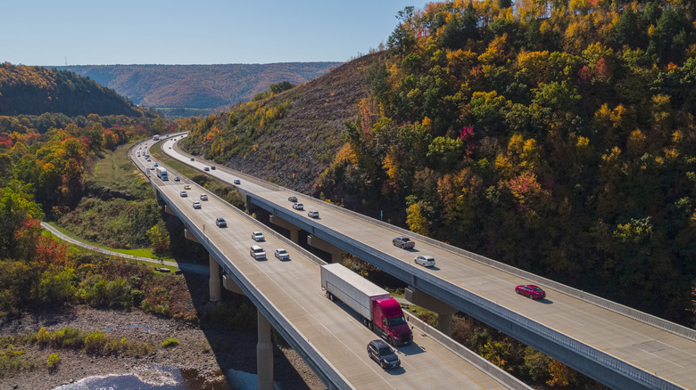 Highway winding through plush countryside