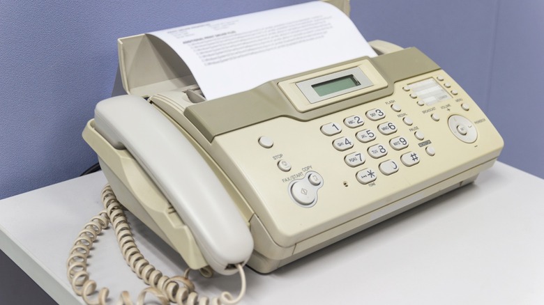 Fax machine with paper sticking out