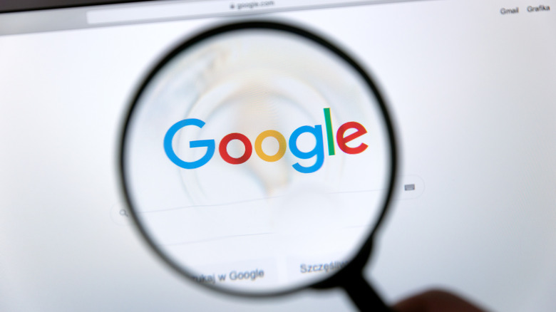 Google logo under magnifying glass