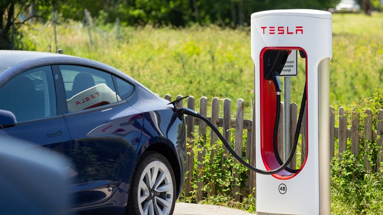Tesla EV connected to a supercharger 