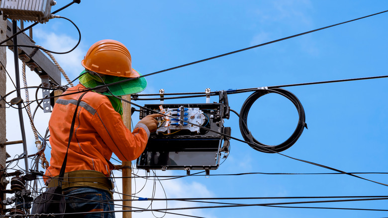 Technician installing fiber optic cable