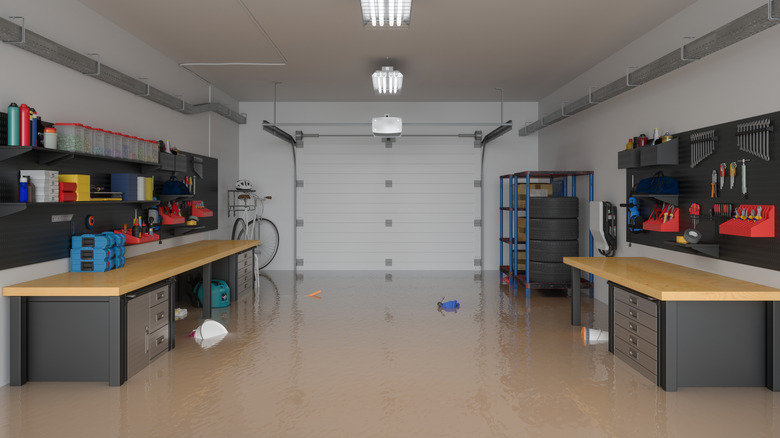 A flooded garage with tools floating on the water