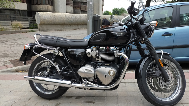 Black Triumph T120 Bonneville motorcycle parked