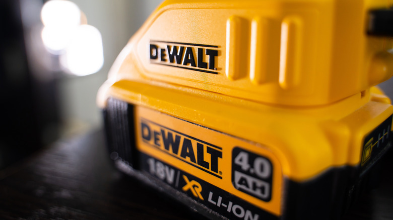 A DeWalt battery connected to a DeWalt charger.