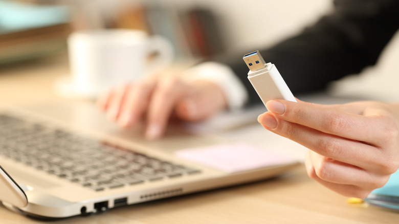 Holding a USB stick in hand