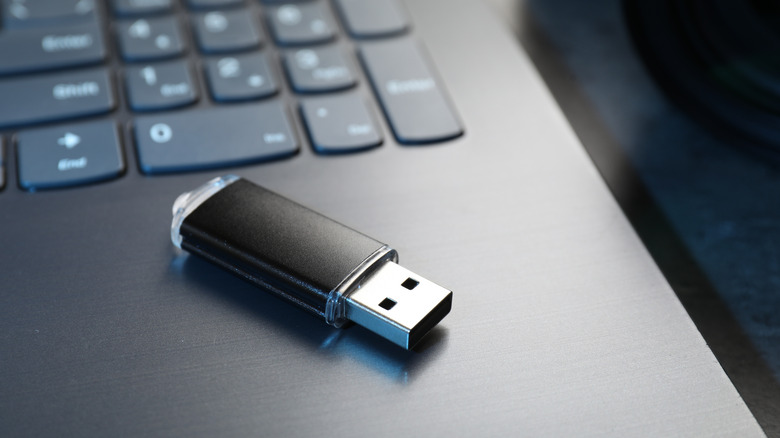 A generic USB drive on a laptop