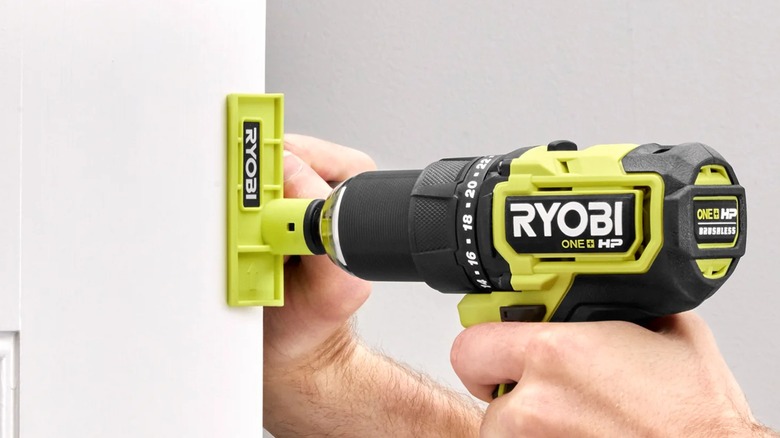 A person using a Ryobi door trimmer