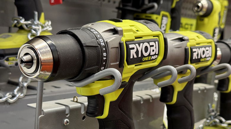 Ryobi drills lined up on shelf