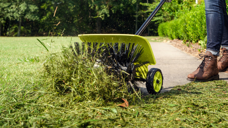 Ryobi Expand-It Sweeper attachment in use