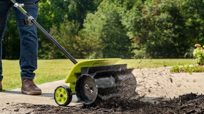 Ryobi Expand-It rubber broom attachment.