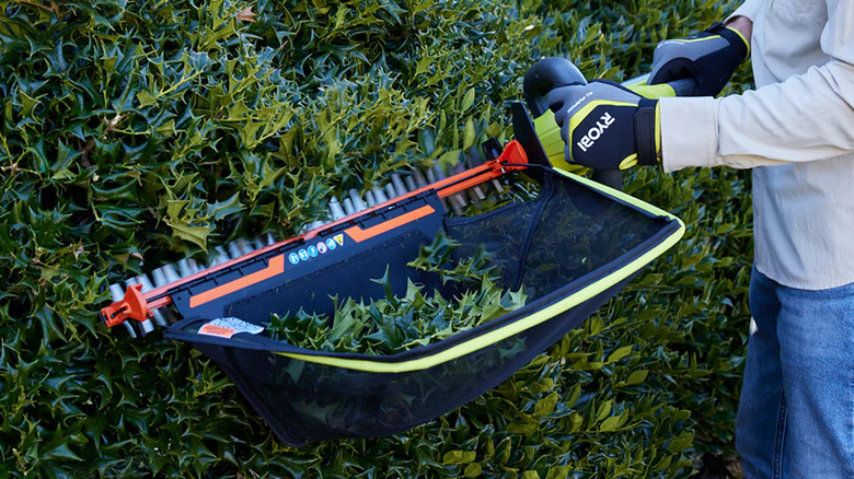 Ryobi debris collector attachment on a hedge trimmer