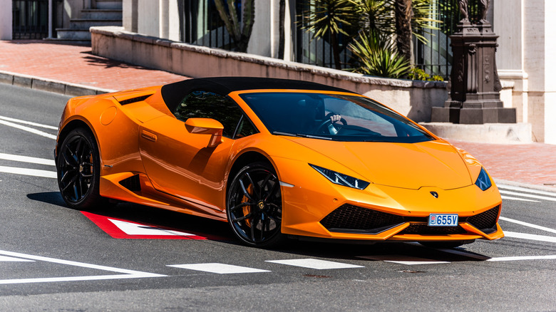Orange Huracan Spyder on the street