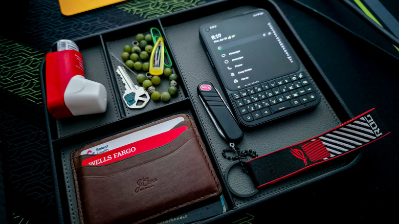 Nordik by Design valet tray containing a smartphone, wallet, and other items