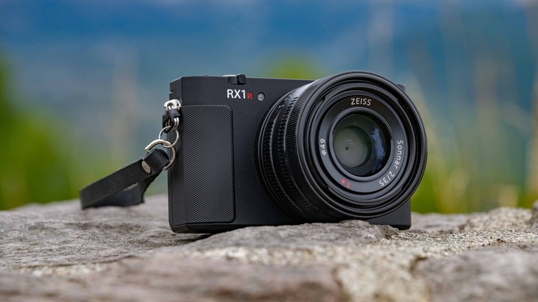 The Sony RX1R iii sitting on a rock.