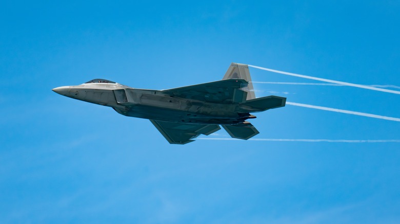 F22 Raptor flying against a blue sky