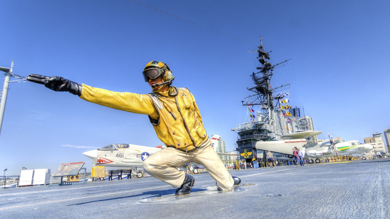 A catapult officer giving the go-ahead for launch