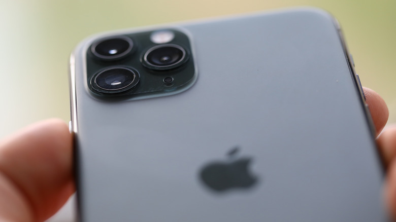 man holding iphone closeup