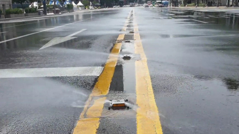 Road studs spraying water to keep the roads cool