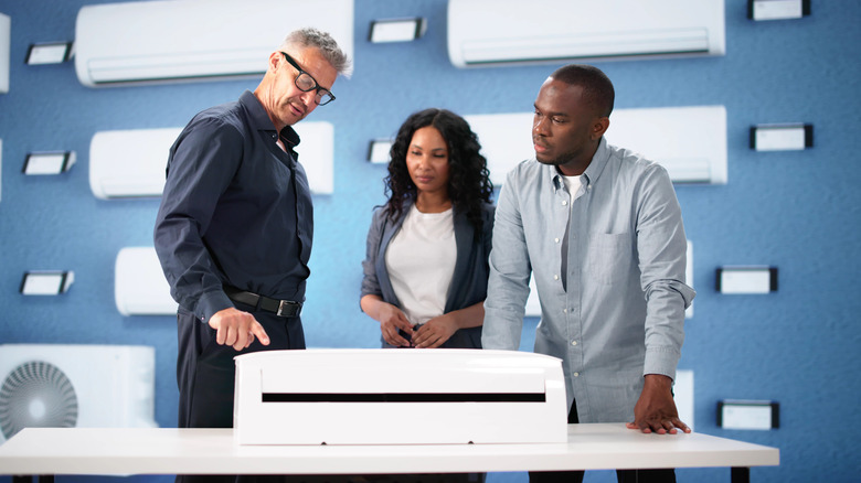 A couple shopping for a new air conditioner