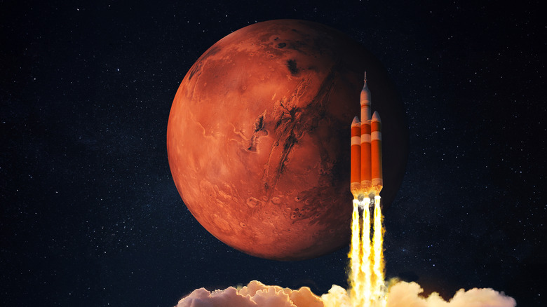 Penggambaran seorang seniman tentang roket dengan latar belakang Mars.