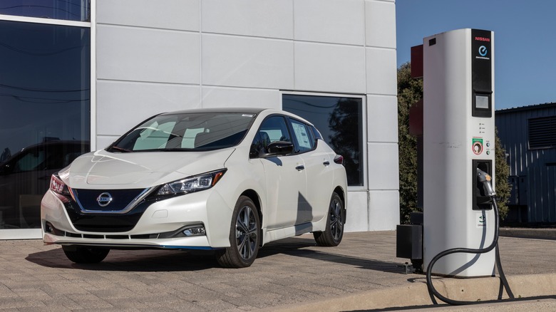 Nissan Leaf next to EV charger