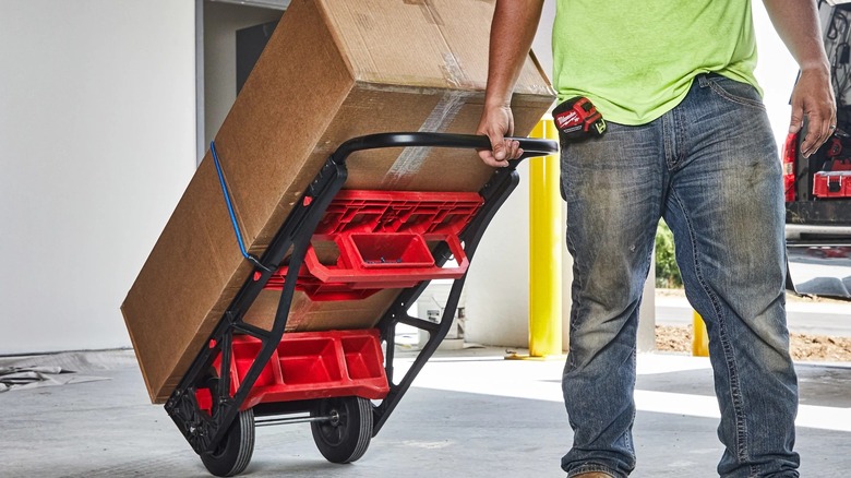 A box being transported on Milwaukee 2-Wheel Cart.