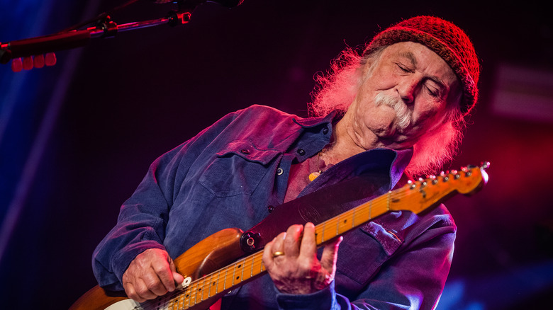 David Crosby playing guitar