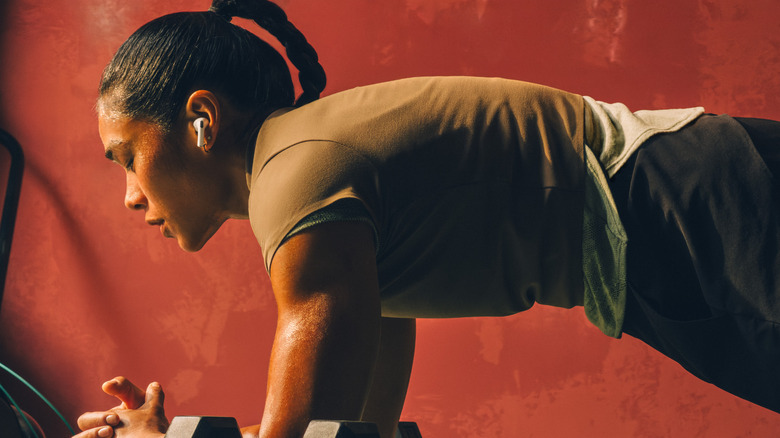 woman wearing airpods pro 3 while working out